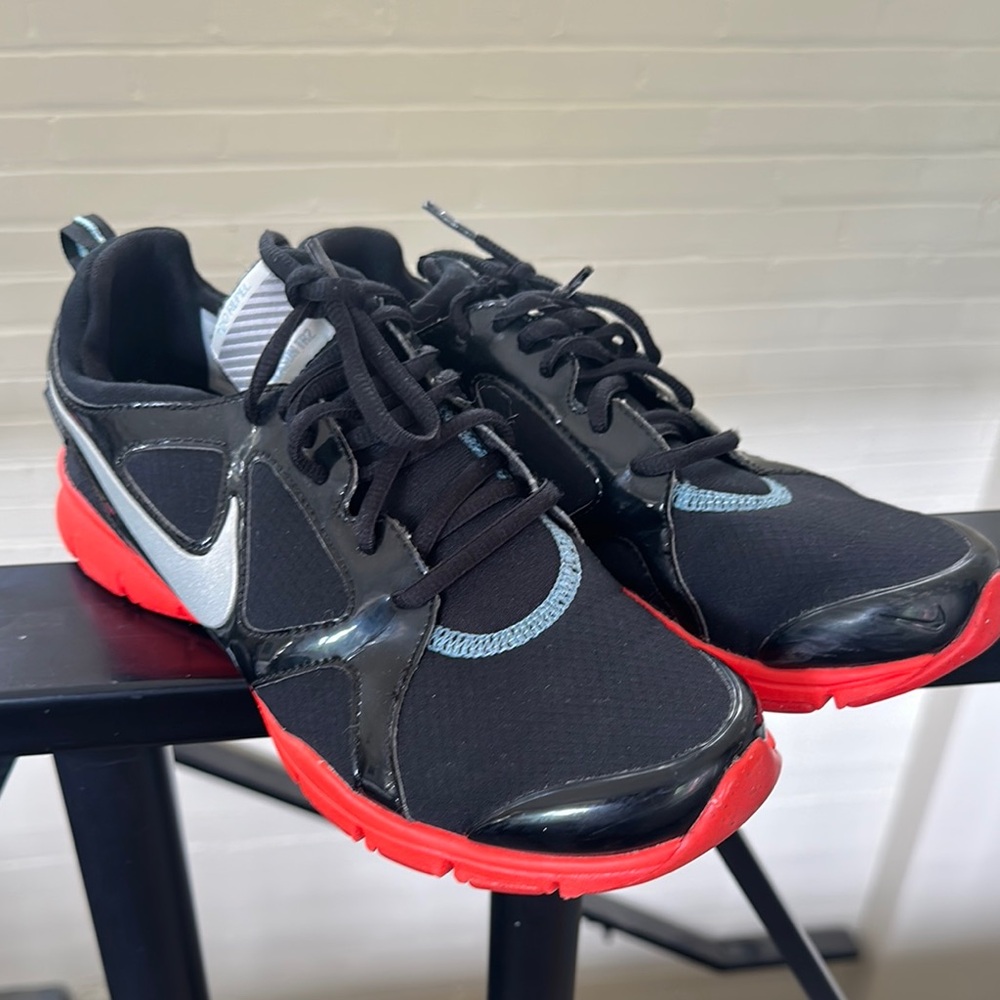 Women’s Nike Black and orange Running Shoes with Silver Swoosh size 8.5